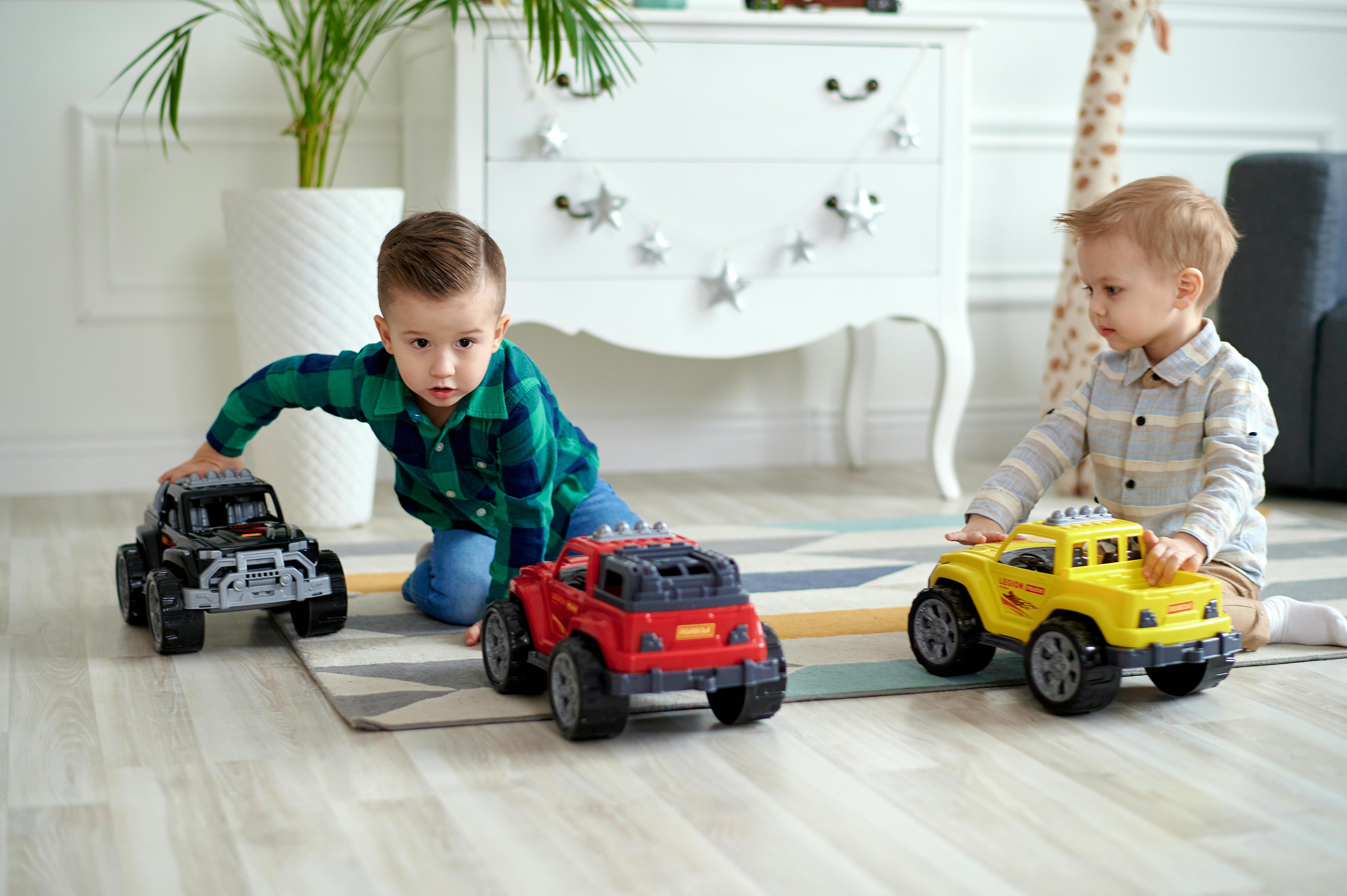 Kids riding electric ride-on cars